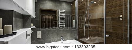 Modern bathroom interior designed in white grey and brown panorama