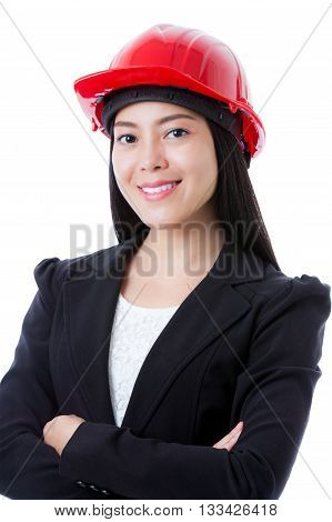 Portrait of attractive professional female contractor wearing red helmet. Cheerful asian businesswoman smiling and looking at camera. Isolated on white background.