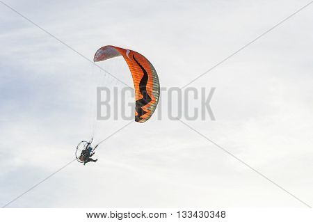 Man Ride Paramotor Flying In The Sky