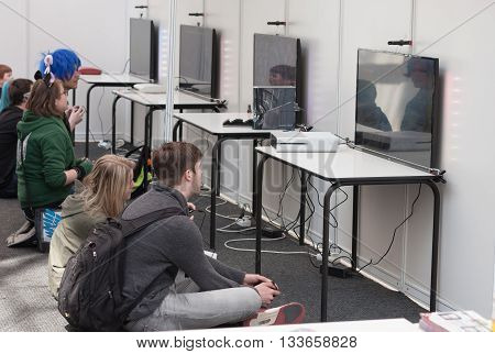 Unidentified Teenagers Playing Console Games At Animefest