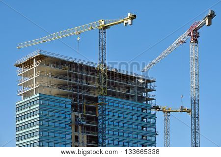 VILNIUS LITHUANIA - OCTOBER 06: Construction progressing of office building in Vilnius on October 06 2015 in Vilnius Lithuania. Vilnius is the capital of Lithuania and its largest city.