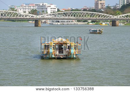 HUE, VIETNAM - JANUARY 08, 2016: Tourist boat on Perfume river in Hue. Tourist landmark of the city Hue, Vietnam