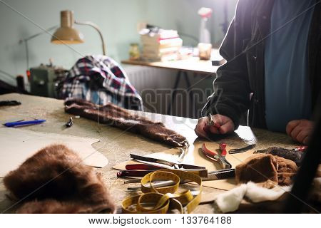 Workshop furrier, utensils, tools and pieces of natural fur