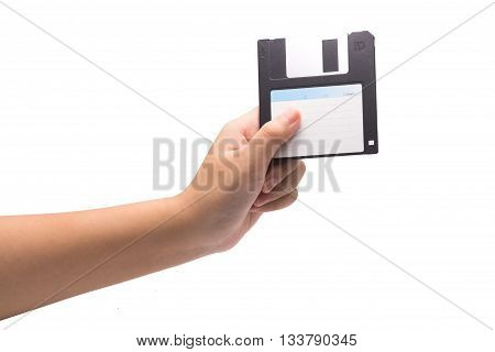 One Human Hand Holding A Black 3.5 Inch Manetic Diskette Isolated On White.