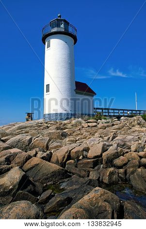Annisquam lighthouse guides mariners around the rocky coastline of the Massachusetts North Shore.