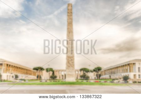 Defocused Background With Marconi Obelisk, In Eur District, Rome, Italy