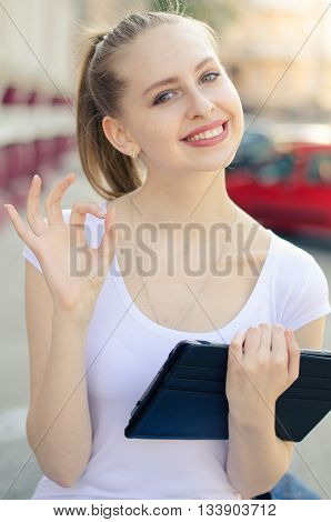 Young  Woman Using Tablet In The City
