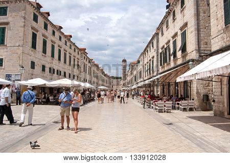 DUBROVNIK, CROATIA - JUNE13, 2010: Summer scene of the main street (Stradun or Placa) with locals and tourists in Dubrovnik, Croatia
