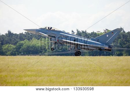 BERLIN / GERMANY - JUNE 3 2016: german eurofighter typhoon lands on airport schoenefeld berlin / germany at june 3 2016.