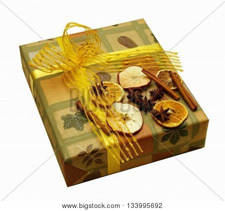 Luxury packed present decorated with dry apple, orange and cinnamon pieces