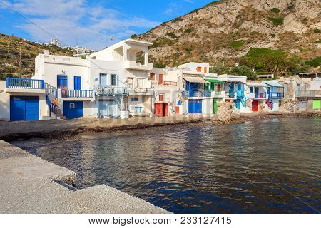 Traditional Greek Houses With Coloured Wooden Doors In Klima Village On Milos Island, Cyclades, Gree