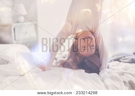 World Upside Down. Enthusiastic Excited Cute Child Trying Making A Cartwheel While Goofing Around An