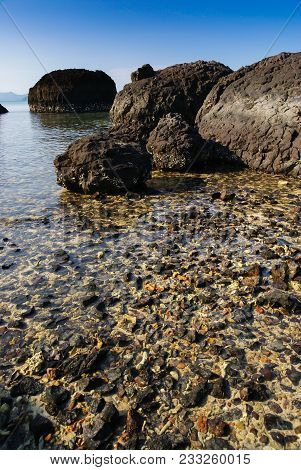 Volcanic rocks in the sea located at Kham Island in Thailand
