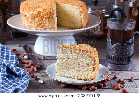 Homemade Biscuit Cake With Sour Cream On A Wooden Table