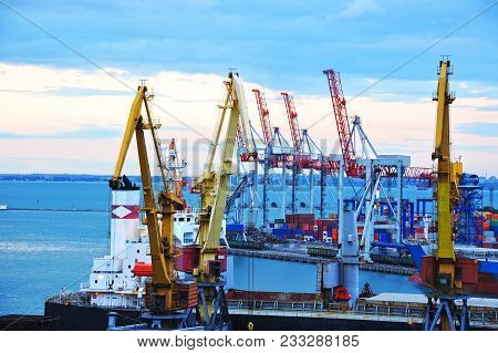 Ship Under Crane At Sunset