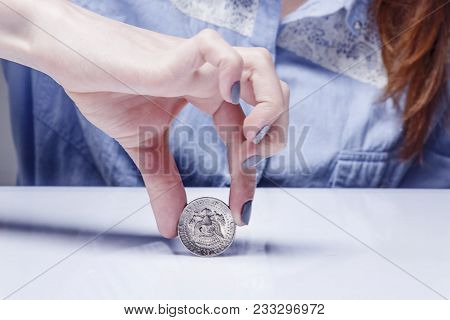 Woman Spinning A Coin To Make Decision. Heads Or Tails Game. (chance, Opportunity, Fortune, Luck Con