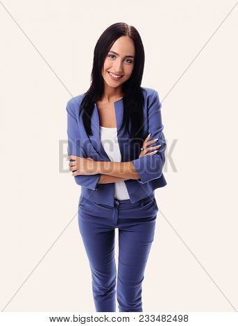 Full length portrait of a smiling businesswoman looking at camer