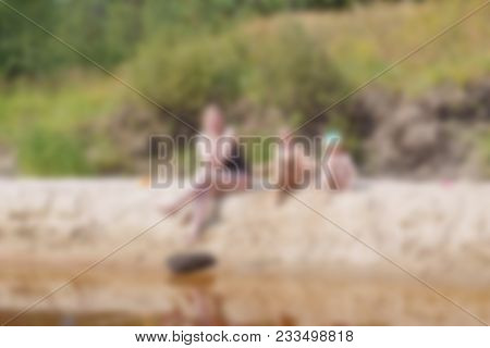 Holidays With Children On A Forest River Theme Creative Abstract Blur Background With Bokeh Effect. 