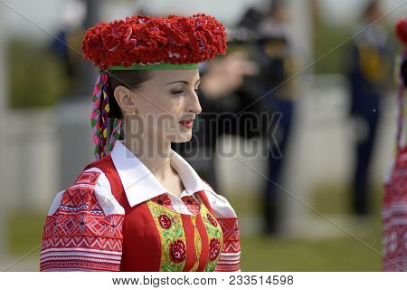 Minsk, Belarus - May 8: Belarusian Woman In National Clothes During Solemn Ceremony Of Hoisting The 