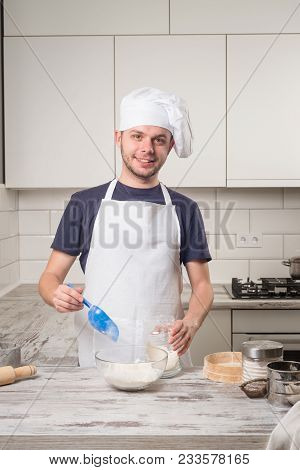 Portrait Of A Male Chef Cook Praparation Pastry On A Kitchen