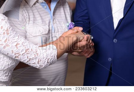 Bride And Groom Holding Hands Close Up