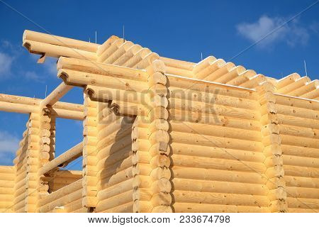 Big Rural House Construction From Sandy Brown Smooth Planed Heady Pine Logs On Bright Sunny Winter D
