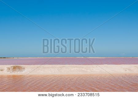 Striking Red Pool Used In The Production Of Salt Near Rio Lagartos, Mexico, Yucatan.