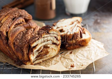 Cinnamon Chocolate Babka On A Cooling Rack With Milk