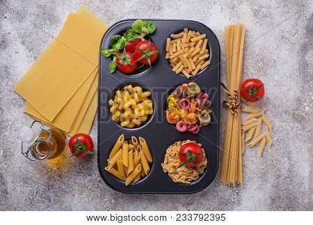 Various Type Of Pasta And Cherry Tomato. Top View