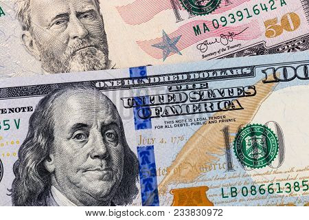 Close-up Of Hundred And Fifty Dollar Bills Portraits Of Presidents Franklin And Grant Background