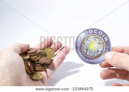 Cryptocurrency Hand Is Holding Euro Coins And A Gridcoin In A Composition