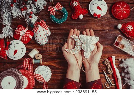 Felt Christmas Decorations On The Wooden Table - Woman Is Preparing For Handmade