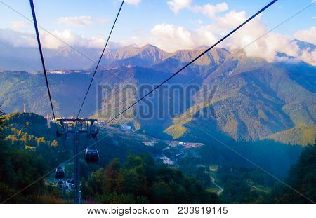 Cable Car High In The Mountains At Sky Level Of The Mountains And Clouds In The Summer In The Forest