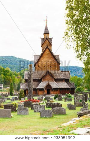 Heddal, Norway-august 15, 2014 - Old Stave Church And Cemetery In Norwegian Village.