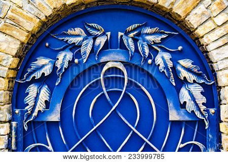 The Decoration Of The Metal Gate With Beautiful Forged Elements.