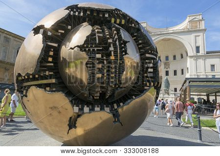 Rome, Italy - August 17, 2019: Modern Sculpture. A Sphere In A Sphere In The Center Of The Pine Cone