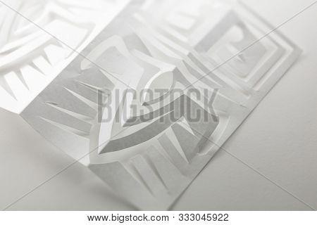 Papercuttting. Paper cut piece on white background.