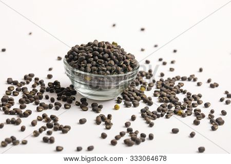 Black Gram Seed Or Udad Beans In Bowl On White Background