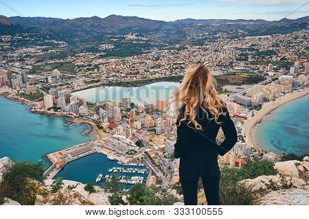 Rear View Woman Climbed Up On Peak Of Penon De Ifach Rock Enjoy Picturesque View Mediterranean Sea, 