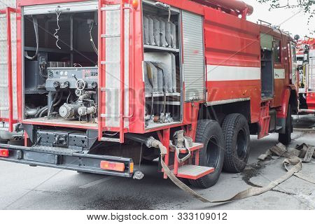 Red Fire Truck, The General Plan. Fire Department Work At The Scene