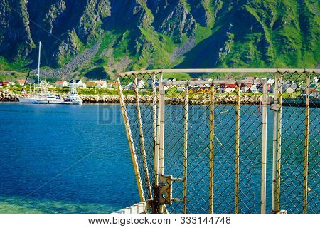 Fishing Port Old Pier And Gate With Bleik Village Houses In The Background. Andoya Island, Vesterale