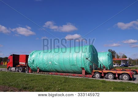 A Two Truck With A Special Semi-trailers For Transporting Oversized Loads. Oversize Load Or Exceptio