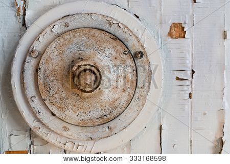 Round Aged Metal Object And A White Painted Wood Panel. Fragment Of A Vintage Abstract Installation
