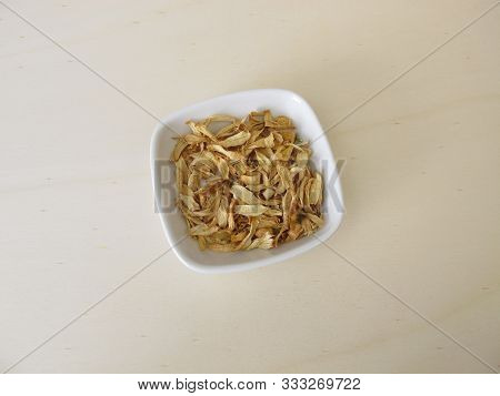 Dried Orange Blossoms Of Sweet Orange On A Wooden Board
