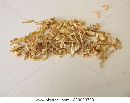 Dried Orange Blossoms Of Sweet Orange On A Wooden Board