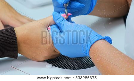 Hardware Manicure. Manicurist Makes Hardware Manicure For Woman In Beauty Salon. Master Of Manicure 