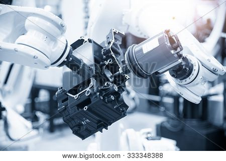 The Automotive Parts Finishing Process By Milling Spindle Attach At The Robotic Arm. The Aluminium C