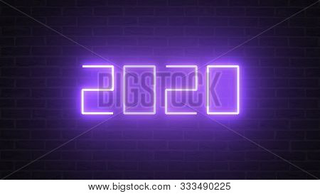 Happy New Year 2020 With Flickering Purple Neon Light On Brick Wall Background. Glowing Abstract And