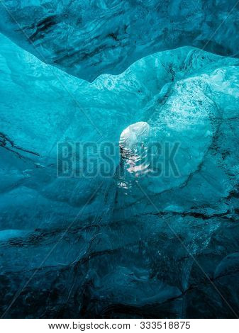 Ice Caves Or Crystal Caves In Icelandic Glaciers Are A Truly Mesmerizing Wonder Of Nature. The Blue-