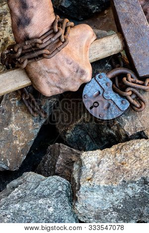 Slave Chain Tied Hands Hold A Hammer. The Desire To Free Oneself. The Desire To Break The Shackles.